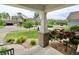 Neighborhood view from the covered front porch with decorative brick pillars and stone landscaping at 5473 Forest Glen Dr, Brownsburg, IN 46112