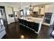 Bright kitchen with granite countertops, stainless appliances, and center island with barstools at 5473 Forest Glen Dr, Brownsburg, IN 46112