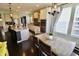 Eat-in kitchen featuring stainless steel appliances and an island with seating, and views to the open floor plan at 5473 Forest Glen Dr, Brownsburg, IN 46112