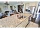 Bright kitchen with stainless steel appliances, granite countertops, and a view to the open living space at 5473 Forest Glen Dr, Brownsburg, IN 46112