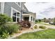 Charming landscaping with an array of bushes and other plants around the base of the house at 5473 Forest Glen Dr, Brownsburg, IN 46112