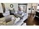 Comfortable living room with an open concept design, plush seating, and view of the stairs at 5473 Forest Glen Dr, Brownsburg, IN 46112