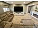 Comfortable living room features a fireplace and a large gray sectional sofa at 5473 Forest Glen Dr, Brownsburg, IN 46112