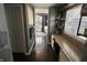 Hallway with an office nook featuring granite counters, natural light, and built in shelves at 5473 Forest Glen Dr, Brownsburg, IN 46112