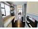 Hallway with an office nook featuring granite counters, natural light, and built in shelves at 5473 Forest Glen Dr, Brownsburg, IN 46112