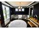 Spacious playroom featuring a toy kitchen, piano, and a large window at 5473 Forest Glen Dr, Brownsburg, IN 46112