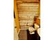 Stylish powder room with a wood accent wall, toilet, and small sink at 5473 Forest Glen Dr, Brownsburg, IN 46112