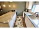 This wet bar features stone countertops, stainless steel sink, and modern finishes at 5473 Forest Glen Dr, Brownsburg, IN 46112