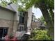Backyard featuring brick architecture, multiple patios, and mature trees at 5586 S 200 E, Franklin, IN 46131