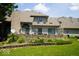 Home's rear exterior featuring a brick patio, manicured landscaping, and multiple windows for ample natural light at 5586 S 200 E, Franklin, IN 46131