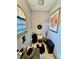Compact bathroom featuring a stylish toilet, a modern black rug, and framed abstract wall art at 5586 S 200 E, Franklin, IN 46131