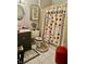 Bathroom with unique card-themed decor, including shower curtain and matching rug at 5586 S 200 E, Franklin, IN 46131