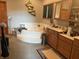 Bathroom with a jacuzzi tub, wood cabinets, and neutral-colored walls at 5586 S 200 E, Franklin, IN 46131