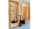 Entry into bathroom with toilet, white tile floor, and black accent rug, featuring neutral walls at 5586 S 200 E, Franklin, IN 46131