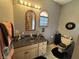 Updated bathroom featuring a granite countertop, window, and tile floors at 5586 S 200 E, Franklin, IN 46131