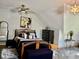Well lit attic bedroom with sloped ceilings, modern decor, and comfortable queen bed at 5586 S 200 E, Franklin, IN 46131