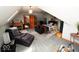 Large bedroom featuring sloped ceilings, neutral tones, and a comfortable chaise lounge at 5586 S 200 E, Franklin, IN 46131