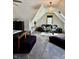 Attic bedroom with sloped ceilings, a sitting area and a large window offering natural light at 5586 S 200 E, Franklin, IN 46131
