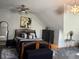 Bedroom featuring modern furniture, stylish lighting, and art on the walls at 5586 S 200 E, Franklin, IN 46131