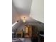 Bonus room featuring a corner fireplace, wood trim, open doorway, and ceiling fan at 5586 S 200 E, Franklin, IN 46131