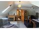 Bonus room featuring modern furniture, stylish lighting, open doorway, and corner fireplace at 5586 S 200 E, Franklin, IN 46131