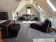 Bonus room featuring modern furniture, stylish lighting, and angled skylights at 5586 S 200 E, Franklin, IN 46131