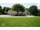 Charming two-story home with a three-car garage, manicured lawn, and a circular driveway at 5586 S 200 E, Franklin, IN 46131