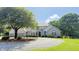 Well-maintained two-story home featuring professional landscaping and a circular gravel driveway at 5586 S 200 E, Franklin, IN 46131