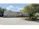 Spacious two-story home with a three-car garage and mature landscaping, sitting on a gravel circular driveway at 5586 S 200 E, Franklin, IN 46131