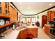 Well-lit kitchen featuring wood cabinetry, stainless appliances, and a breakfast bar at 5586 S 200 E, Franklin, IN 46131