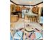 Well-lit kitchen features stainless steel appliances, breakfast bar with seating, and an adjacent dining area at 5586 S 200 E, Franklin, IN 46131