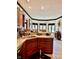 Well-lit kitchen with oak cabinets, a breakfast bar, and a sunlit dining area at 5586 S 200 E, Franklin, IN 46131