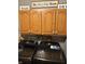 Functional laundry room with oak cabinets above modern Samsung washer and dryer units at 5586 S 200 E, Franklin, IN 46131