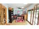 Spacious living room with fan, wood trim windows and doors, a flat screen tv and sports themed decor at 5586 S 200 E, Franklin, IN 46131