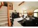 Spacious living room featuring vaulted ceilings, large arched windows, and a cozy fireplace at 5586 S 200 E, Franklin, IN 46131