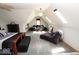 Brightly lit attic conversion featuring lounge sofa, chaise lounge and skylights at 5586 S 200 E, Franklin, IN 46131
