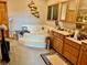 Main bathroom featuring a large tub, vanity area, and neutral walls at 5586 S 200 E, Franklin, IN 46131