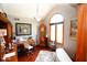 Comfortable home office boasting hardwood floors, ample desk space, and a large arched window at 5586 S 200 E, Franklin, IN 46131