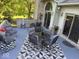 Inviting patio area featuring comfortable seating, stylish decor, and elegant glass-topped table for outdoor enjoyment at 5586 S 200 E, Franklin, IN 46131