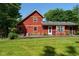 The backyard features a well-manicured lawn and deck at 5631 Shelby St, Indianapolis, IN 46227