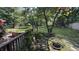 Expansive backyard featuring a shed, stone bench, and lush greenery at 5631 Shelby St, Indianapolis, IN 46227