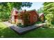 The home has a well-manicured lawn and a backyard deck at 5631 Shelby St, Indianapolis, IN 46227