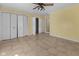 Spacious bedroom includes tile floors and ample storage with a large closet system at 5631 Shelby St, Indianapolis, IN 46227