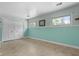 Bright bedroom featuring tile floors, a large closet, and two windows at 5631 Shelby St, Indianapolis, IN 46227