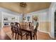 Spacious dining room showcasing wood table, stylish chairs, and seamless access to the kitchen at 5631 Shelby St, Indianapolis, IN 46227