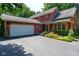 Charming two-story home with an attached garage and professionally landscaped yard at 5631 Shelby St, Indianapolis, IN 46227