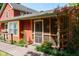 Charming home featuring a screened-in porch and well-maintained landscaping at 5631 Shelby St, Indianapolis, IN 46227