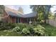 Charming home exterior with a well-manicured front yard and beautiful landscaping at 5631 Shelby St, Indianapolis, IN 46227