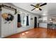 Bright living area with hardwood floors, a window seat, and an open layout to the kitchen at 5631 Shelby St, Indianapolis, IN 46227