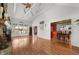 Open living area with vaulted ceilings, fireplace, and views into dining and kitchen spaces at 5631 Shelby St, Indianapolis, IN 46227